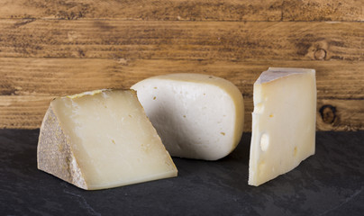 variety of Italian cheeses on stone cutting board