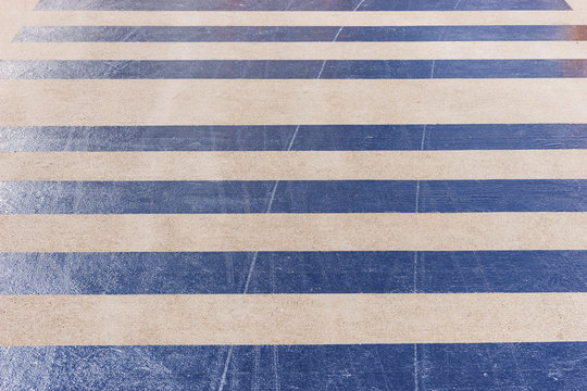 Reflective stripes on the asphalt of the airport landing stage