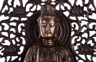 Obraz premium The face of Bodhisattva Guan Yin - the deity acting mainly in a female appearance, saving people from disasters; giver of children, patroness of female half of the house. 