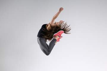 Girl in jump on a gray background