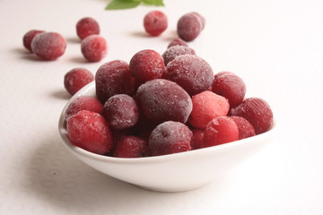 Frozen cranberries on white