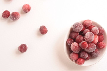 Frozen cranberries on white