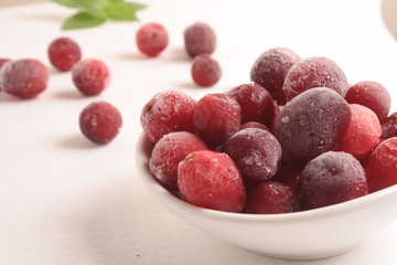 Frozen cranberries on white