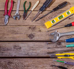 Working tools on wooden rustic background