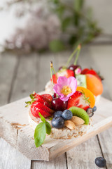 Multigrain rice cakes with berries, fruit and almond for healthy breakfast