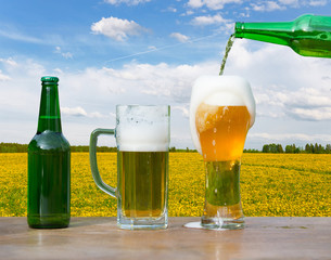 Pouring glass of beer from bottle
