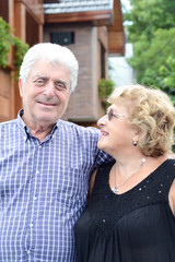 An elderly couple outdoors.