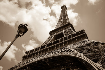 Eiffel tower and Parisian streetlight. Paris (France) Sepia.