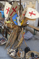 Wooden toy shields and weapons sold at medieval fair.
