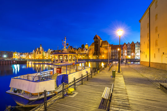 Architecture of the old town in Gdansk over Motlawa river at dusk, Poland
