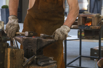 Historial - The Škofja Loka Festival of History, blacksmith forging metal.