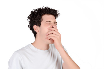 Young man yawning.