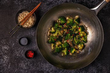 Cooking asian wok with stir fry vegetables