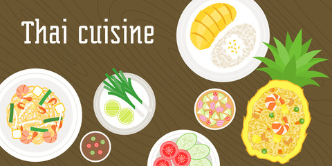 THAI dishes on wooden background, pork fried with sweet basil, jasmine rice, fish cakes, sour chilli beef salad in thai style, side dishes and chilli sauce, suitable for banner or poster