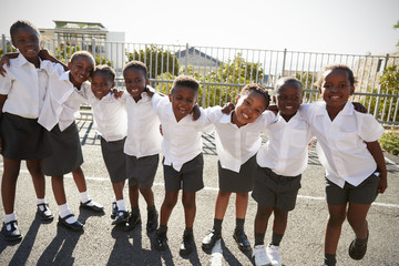 Elementary school kids in Africa posing in school playground