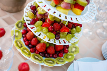 Wedding table fruit decoration at restaurant, pineapple, strawberry, grape