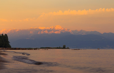 Sunset over the lake Leman and the part of Alps