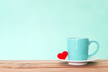 Coffee cup mug with red heart shape on wooden table , Romance and love valentines day background concept