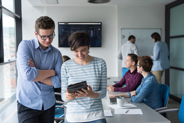 Two Business People Working With Tablet in office