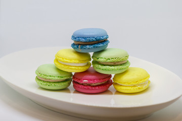 Sweet and colourful french macaroons or macaron on white background, Dessert.