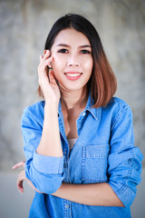 Asian woman casual outfits standing in jeans and blue denim shirt, women brown hair and short hair, beauty and fashion jeans concept