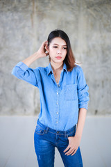 Asian woman casual outfits standing in jeans and blue denim shirt, women brown hair and short hair, beauty and fashion jeans concept