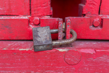 Old lock on the red door, close-up. focus on lock
