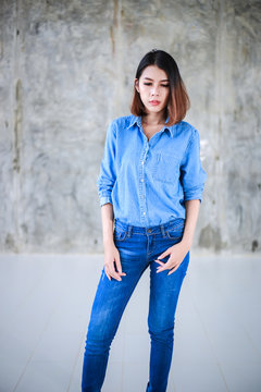 Asian woman casual outfits standing in jeans and blue denim shirt