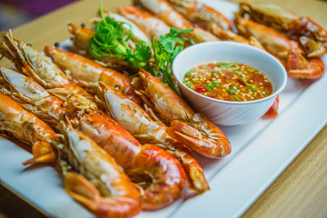 Grilled shrimps served on the table.