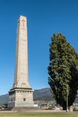 Hobart, Australia - March 19. 2017: Tasmania. Closeup of tall white stone Cenotaph war memorial and...