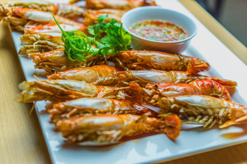 Grilled shrimps served on the table.
