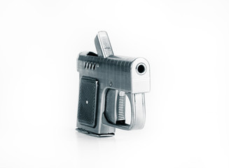 Lighter in the form of a gun on a light background. Toned