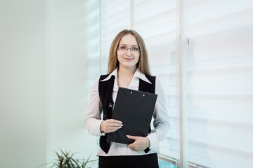 Modern business woman in the office with copy space,Business woman portrait,Successful business woman looking confident and smiling,business woman in glasses,copy space