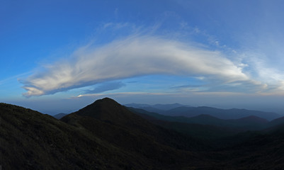 Fototapeta premium mountain range tropical rainforest canopy at southern of Thailand with more cloud background blue sky