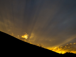 Sunset behind hill