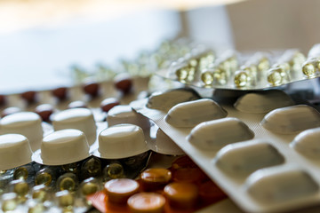 Close up of pills. Color tablets for the treatment of sick people. Shallow depth of focus, copy space. Concept healthcare.