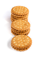 A stack of cicle biscuits puff sandwich cream isolated on white