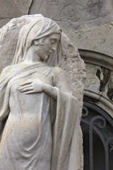 Statue of a classical female in cemetery