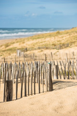 Wooden fence on Atlantic beach in France