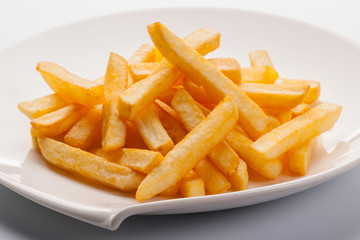 French fries on white plate.