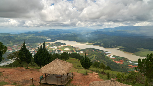 Wide view with storm and rain clouds from the mountain lang biang in Da-lat, Vietnam. Dramatic sky before the rain starts.