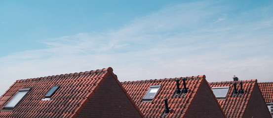 Old dutch house roofs on a sunny day with a clear blue sky, The Netherlands