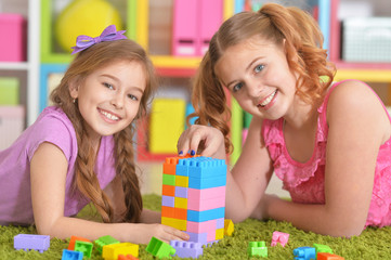 Fototapeta premium Girls playing with blocks