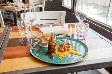 Rooster with wheat mustard and carrot puree.