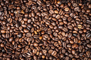 Coffee beans concept on wooden table background.