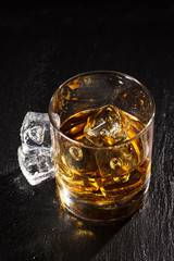 Glass of whiskey with ice
