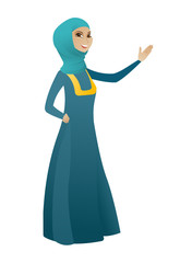 Muslim business woman showing a direction.