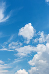 Obraz na płótnie Canvas White fluffy big clouds against blue sky