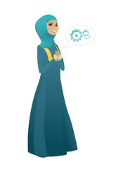 Muslim business woman holding a mobile phone.