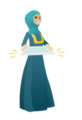 Muslim business woman holding a contract.